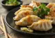 Gyoza med ingefära med krispig botten, god fyllning, serverad med ingefärssås.